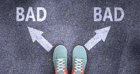 Bad and bad as different choices in life - pictured as words Bad, bad on a road to symbolize making decision and picking either Bad or bad as an option, 3d illustration