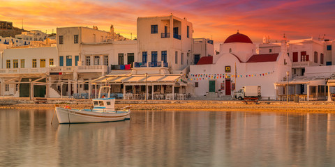 Panoramic view at sunset of old harbour in Mykonos town, Greece, Europe.  Golden hours. Travel and holiday concept. - obrazy, fototapety, plakaty