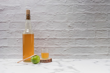 Honey in lemon and wooden spoon