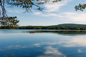 Loch Morlich surrounded by forests and fringed by beaches.