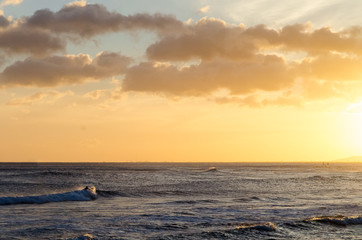 Surfing during Sunset in Hawaii