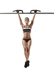 young fitness woman chin-up on horizontal bar