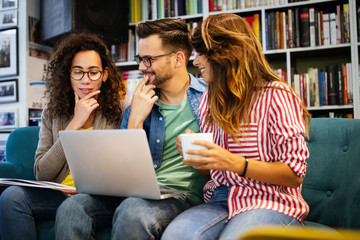 Young university students studying together. Group of multiracial friends in college