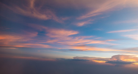 Sunset sky during twilight from airplane window
