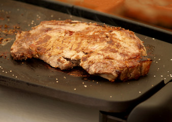 veal chop grilled on grains of salt