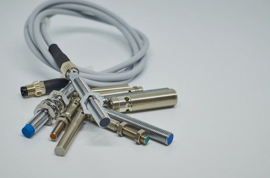 Many Inductive proximity sensor or proximity switch on a white background.