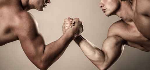 Two hands. Muscular men measuring forces, arms. Hand wrestling, compete. Hands or arms of man. Muscular hand. Clasped arm wrestling - obrazy, fototapety, plakaty