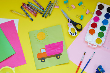 School supplies, stationery on yellow background - space for caption. Child ready to draw with pencils and make application of colored paper. Top view.