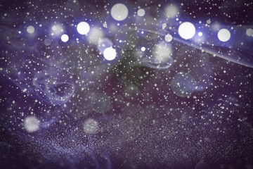 Fototapeta na wymiar fantastic sparkling glitter lights defocused bokeh abstract background with sparks fly, festal mockup texture with blank space for your content