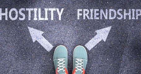 Hostility and friendship as different choices in life - pictured as words Hostility, friendship on a road to symbolize making decision and picking either one as an option, 3d illustration