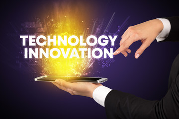 Close-up of a touchscreen with TECHNOLOGY INNOVATION inscription, innovative technology concept