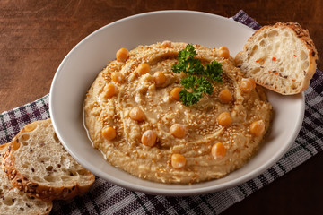 Healthy Homemade Creamy Hummus with Olive Oil and Pita Chips