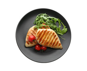 Tasty grilled chicken fillets with tomatoes and arugula isolated on white, top view
