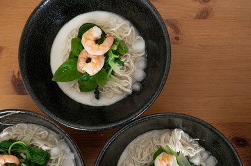 3 bowls of summer asian seafood cold noodles in a coconut milk broth