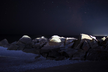 night rocks on the beach near the sea
