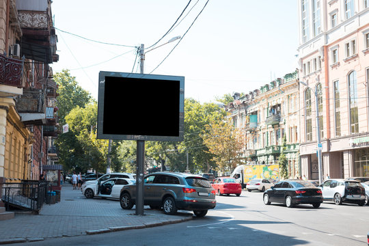 Blank black banner mock up on city billboard on street