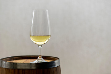 iso crystal bowl with cachaça in wooden barrel. Space for text. cachaça day is september 13