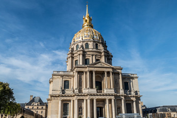 the beautiful facade and the golden dome of the Invalides in Paris