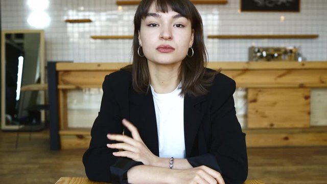 Young female candidate interviewed by employer. Portrait