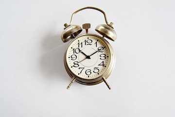 Alarm clock on a light background close-up. The concept of getting up in the morning and being late