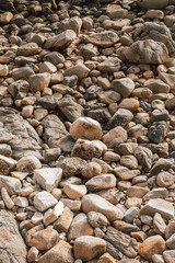 Texture made with outdoors stones on the ocean coast