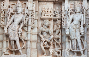 Fototapeta na wymiar Bas-relief of famous Neminath Jain temple in Ranakpur, Rajasthan state of India