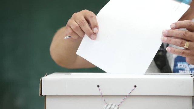 Man casts his ballot at elections