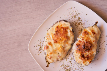 Aubergines stuffed with bacon, tuna, ham, cheese and bechamel