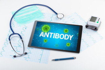 Close-up view of a tablet pc with ANTIBODY inscription, microbiology concept