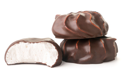 Marshmallow in chocolate whole and half on a white background. Isolated