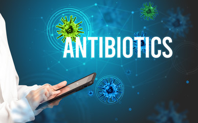 doctor prescribes a prescription with ANTIBIOTICS inscription, pandemic concept