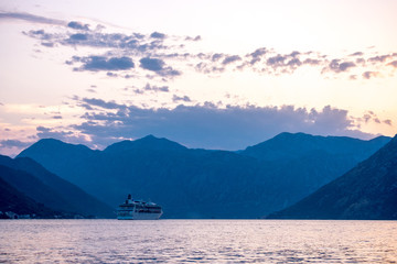 Cruise ship leaves the Bay of Kotor at sunset