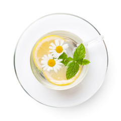 Green herbal tea cup with mint and chamomile