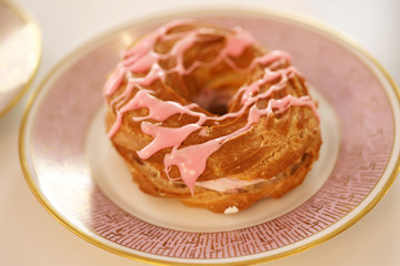 donut with icing sugar and cream