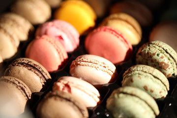 tasty colourful macaroons on a  table