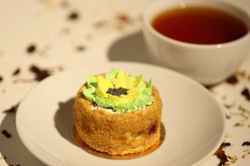 cup of tea and cake on a plate