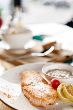 photos of dishes steak salmon in cafes bright Sunny natural light