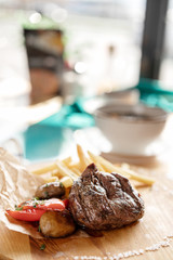 photos of dishes grilled meat French fries in cafes bright Sunny natural light