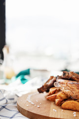 photos of dishes grilled meat French fries in cafes bright Sunny natural light