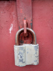  Old rusty vintage lock on a metal door