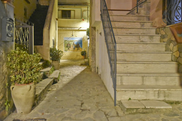 A narrow street between the old houses of San Nicola Arcella, a village in the region of Calabria, Italy.