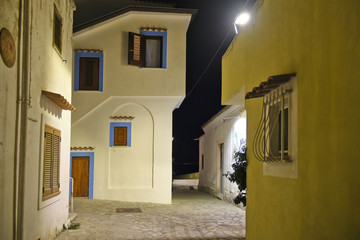 A narrow street between the old houses of San Nicola Arcella, a village in the region of Calabria, Italy.