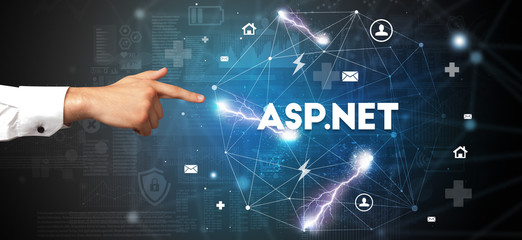 Hand pointing at ASP.NET inscription, modern technology concept