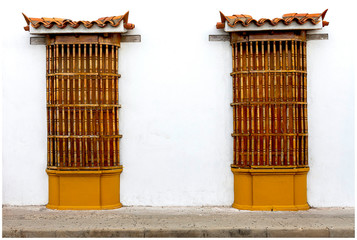 the facade of the old house with two colonial windows.