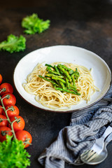 spaghetti green bean asparagus sauce cheese pasta second course vegetarian serving portion size natural product top view place for text copy space