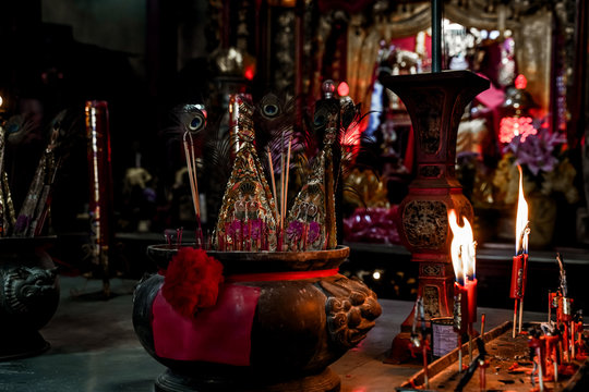 Incense sticks in old chinese temple. Asian traditional culture in shrine.