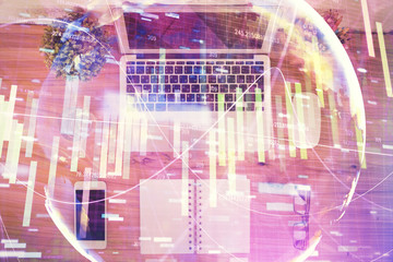 Business theme hologram drawings over computer on the desktop background. Top view. Multi exposure. Concept of international connections.
