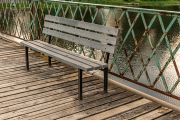 Fototapeta premium Bench on an historical bridge landscape