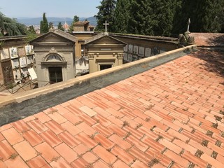 Florence, Tuscany, Italy - 07/14/2018: Basilica of San Miniato al Monte and the cemetery adjacent to the church. The place of rest of the author of 