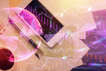 Multi exposure of forex graph hologram over desktop with phone. Top view. Mobile trade platform concept.